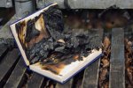 depositphotos_67369563-stock-photo-burned-book-on-the-wooden.jpg